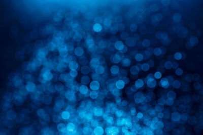 Defocused image of illuminated lights at night