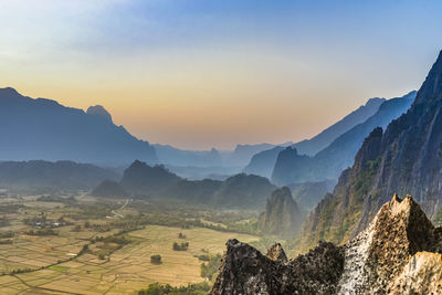 Scenic view of mountains against sky during sunset