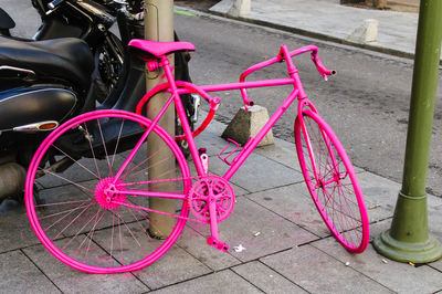 Close-up of bicycle parked on street