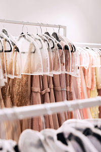 Close-up of clothes hanging on rack