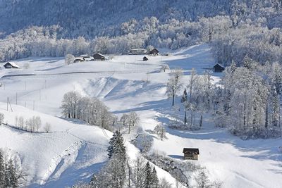Panoramic view of snow covered land and mountains