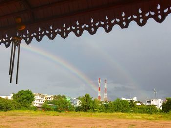 Scenic view of rainbow over building