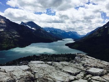 Scenic view of lake and mountains against sky