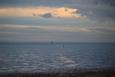 Scenic view of sea at sunset