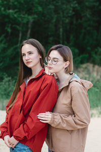 Portrait of a young woman standing outdoors