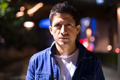 Portrait of young man standing outdoors