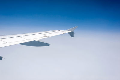 Low angle view of airplane flying in sky