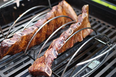 High angle view of meat on barbecue grill