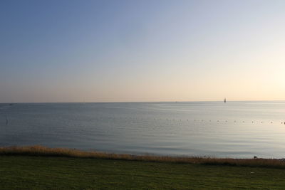 Scenic view of sea against clear sky