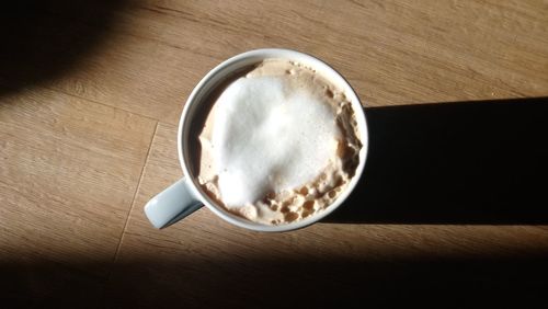 High angle view of coffee cup on table