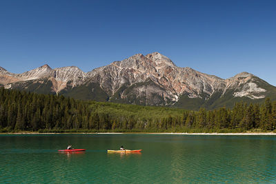 Boats in calm lake