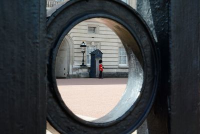 British royal guard seen through fence