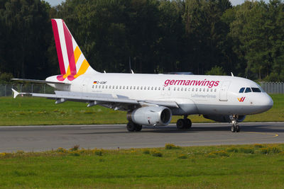 View of airplane at airport runway