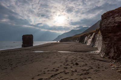 Scenic view of sea against cloudy sky