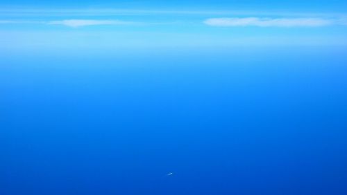 Scenic view of blue sea against sky
