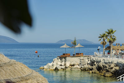 Scenic view of sea against clear blue sky