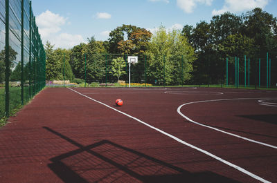 View of basketball court against trees