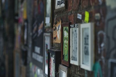 Books on shelf against wall
