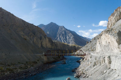 Overpass crossing over mountain river valley on a background of hills. kaza himachal pradesh india 