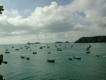 Scenic view of sea against cloudy sky