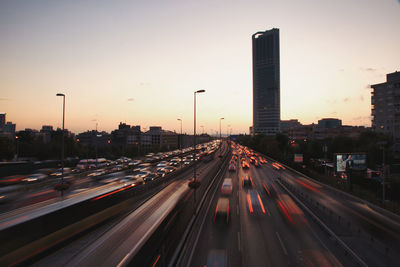 Traffic on highway at sunset