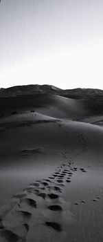 Scenic view of desert against clear sky
