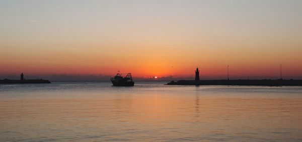 Scenic view of sea against sky during sunset