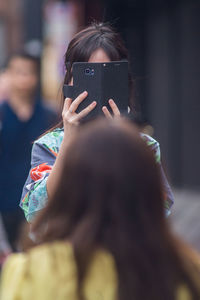 Portrait of woman photographing