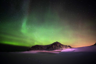 Scenic view of mountain against sky at night