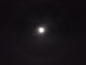 Low angle view of moon against sky at night