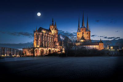 Illuminated buildings in city at night