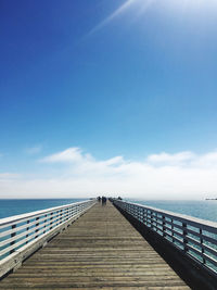 Pier over sea against sky