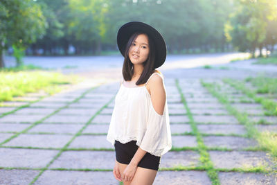 Young woman standing at park