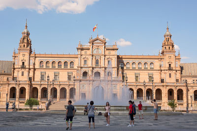 People in front of historical building