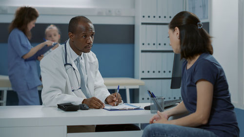 Doctor examining patient at clinic