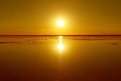 Scenic view of sea against romantic sky at sunset