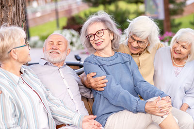 Portrait of smiling friends enjoying at home