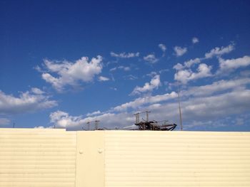 Fence at construction site against sky