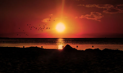 Scenic view of sea against sky during sunset