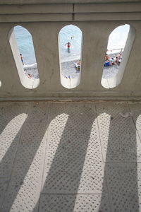 High angle view of shadow hanging on window of building