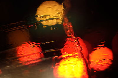 Close-up of illuminated fire hydrant at night