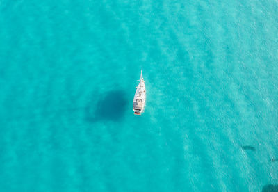 High angle view of a single ship in sea with turquoise waters 