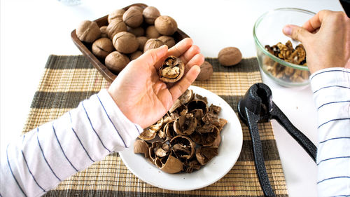 Midsection of man preparing food on table