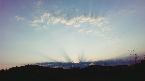 Scenic view of silhouette landscape against sky during sunset