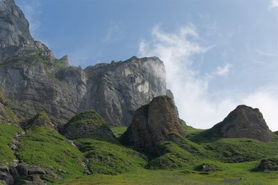 Low angle view of rock formation against sky