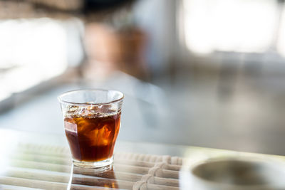 Close-up of tea in glass on table