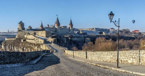 Panoramic view of the castle bridge to kamianets-podilskyi fortress on a sunny winter morning