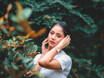 Portrait of smiling woman standing outdoors