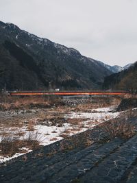 Scenic view of mountains against sky during winter