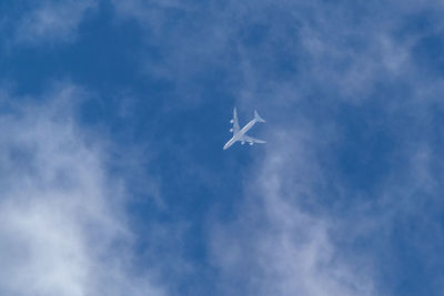 Low angle view of airplane flying in sky
